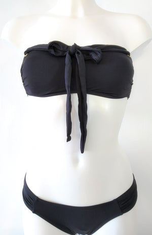 black bikini bandeau bra and low cut bottom with stretchy straps tied on the front as bow . bikinn.com