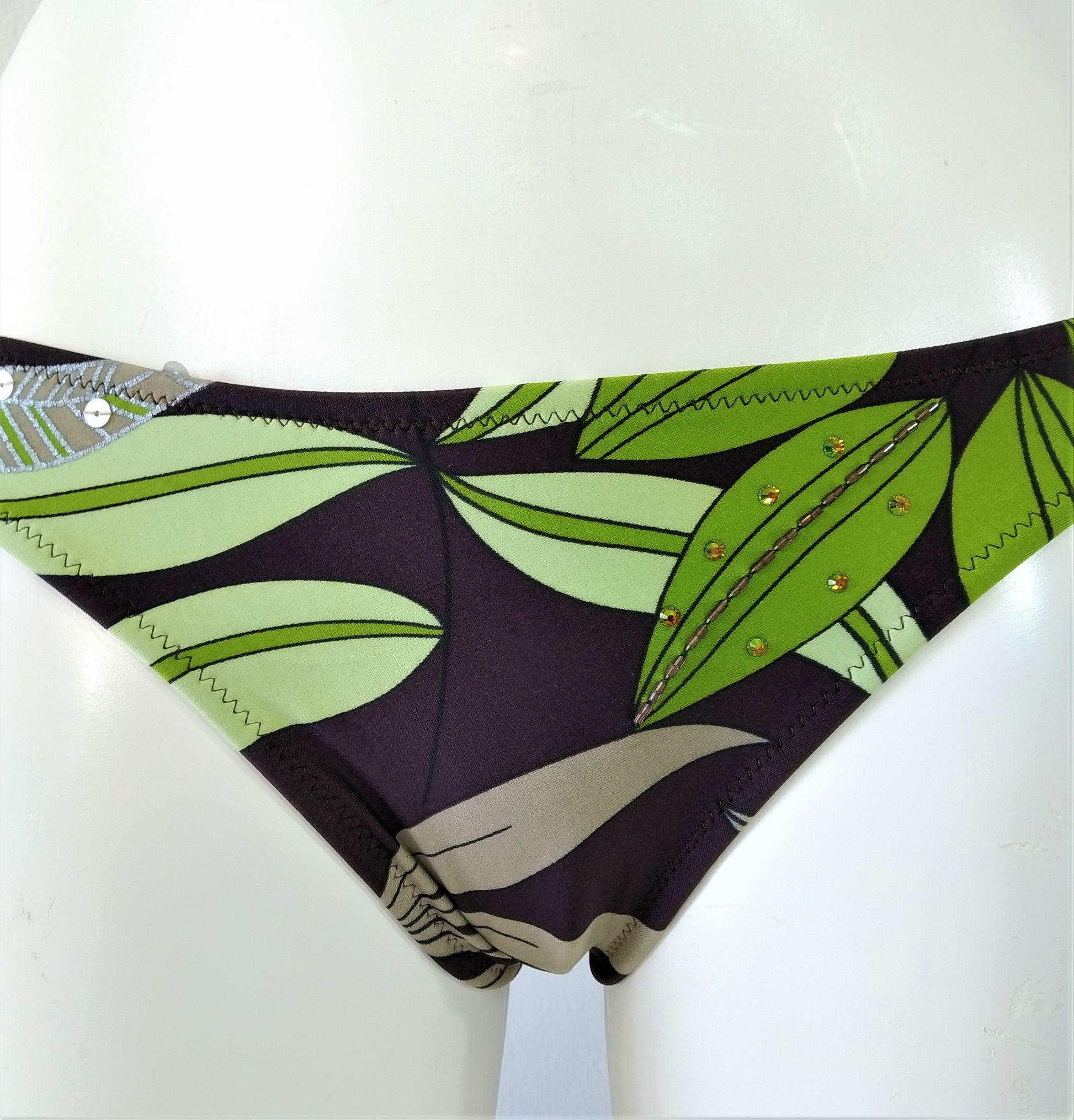 bikini bottom with print of  green leaves on brown background Embellishment: handwork of embroidered beads and sequins. bikinn.com