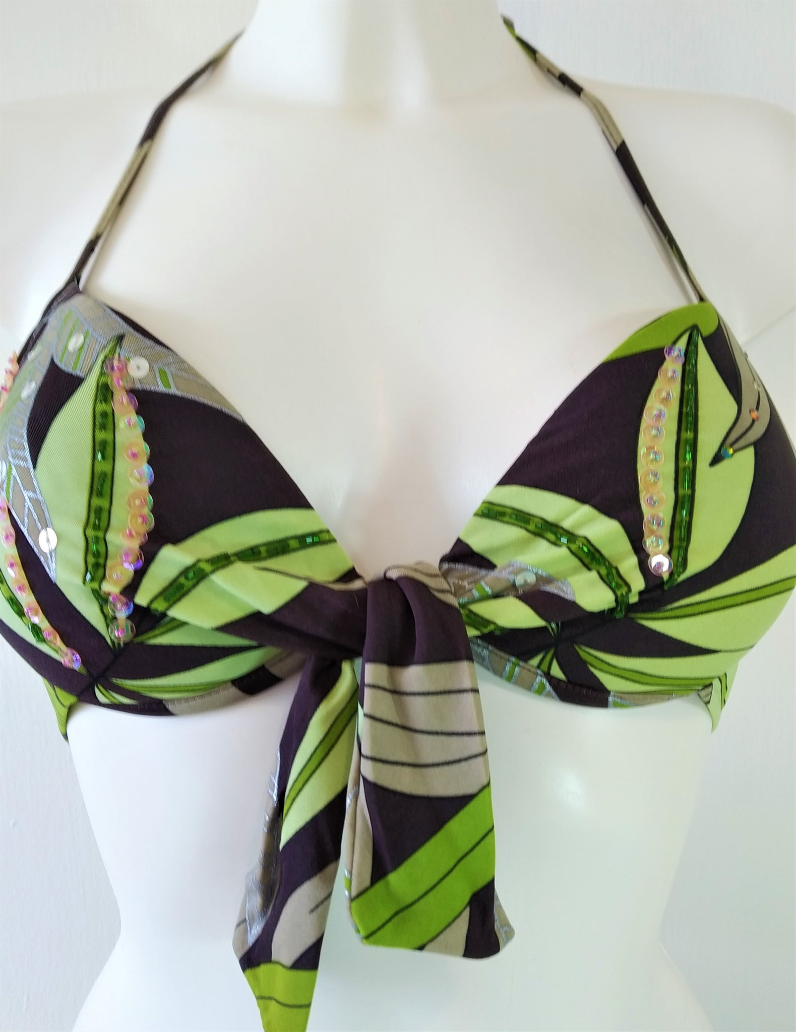 Bra of push-up bikini with print of  green leaves on brown background Embellishment: hand work of embroidered beads and sequins. bikinn.com  