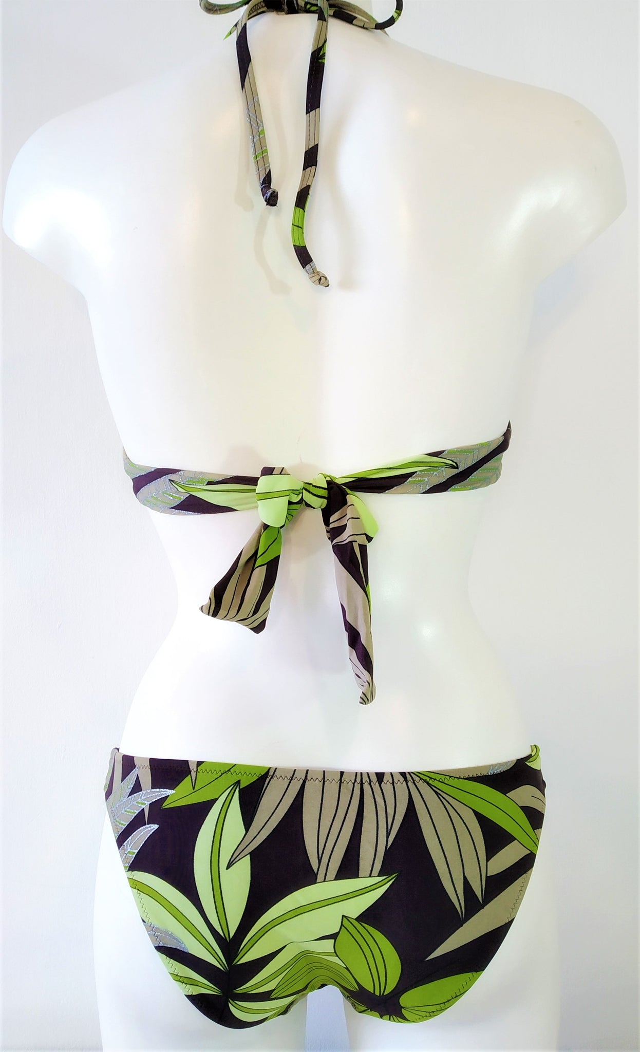 Back view of push-up bikini set with print of green leaves on brown background Embellishment: handwork of embroidered beads and sequins. bikinn.com 