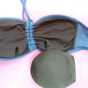 view of the reverse side of the bandeau bra, one light pad of the bra, out for showing. bikinn.com