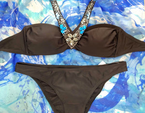  black bikini, bandeau and regular cut panties, with decoration of sparkling stones sewn along the neckline. bikinn.com