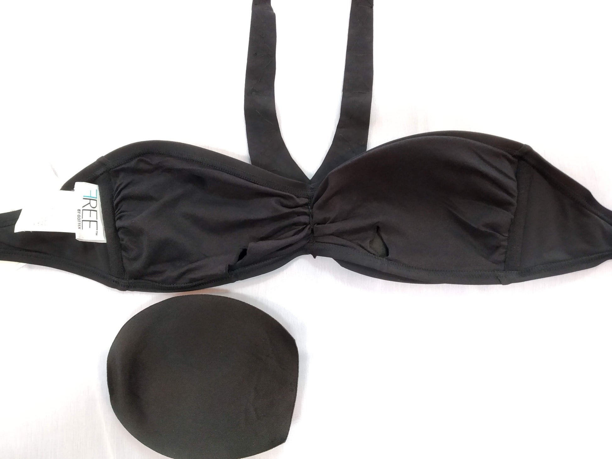 inside view of black bikini, bandeau with decoration of sparkling stones sewn along the neckline. bikinn.com