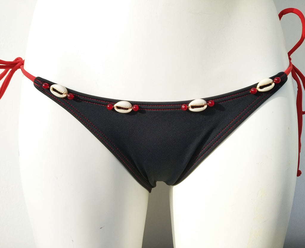 Black tie-side bikini bottom with seashells embellishment. bikinn.com