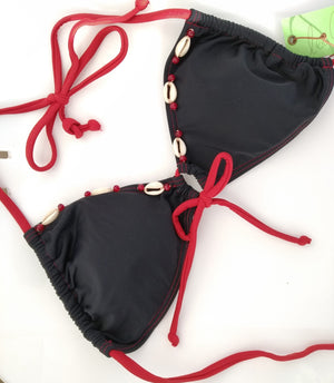 reversed black triangular bikini bra with few seashells sewn for decoration along the neckline . bikinn.com
