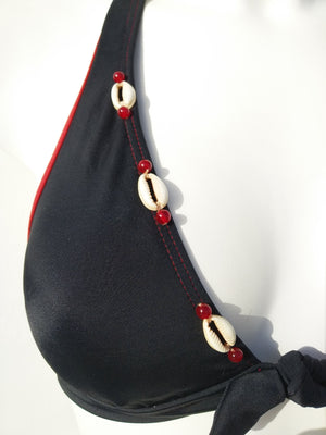 close-up of a black Halter bikini bra withw seashells decoration along the neckline, mix and match collection. bikinn.com