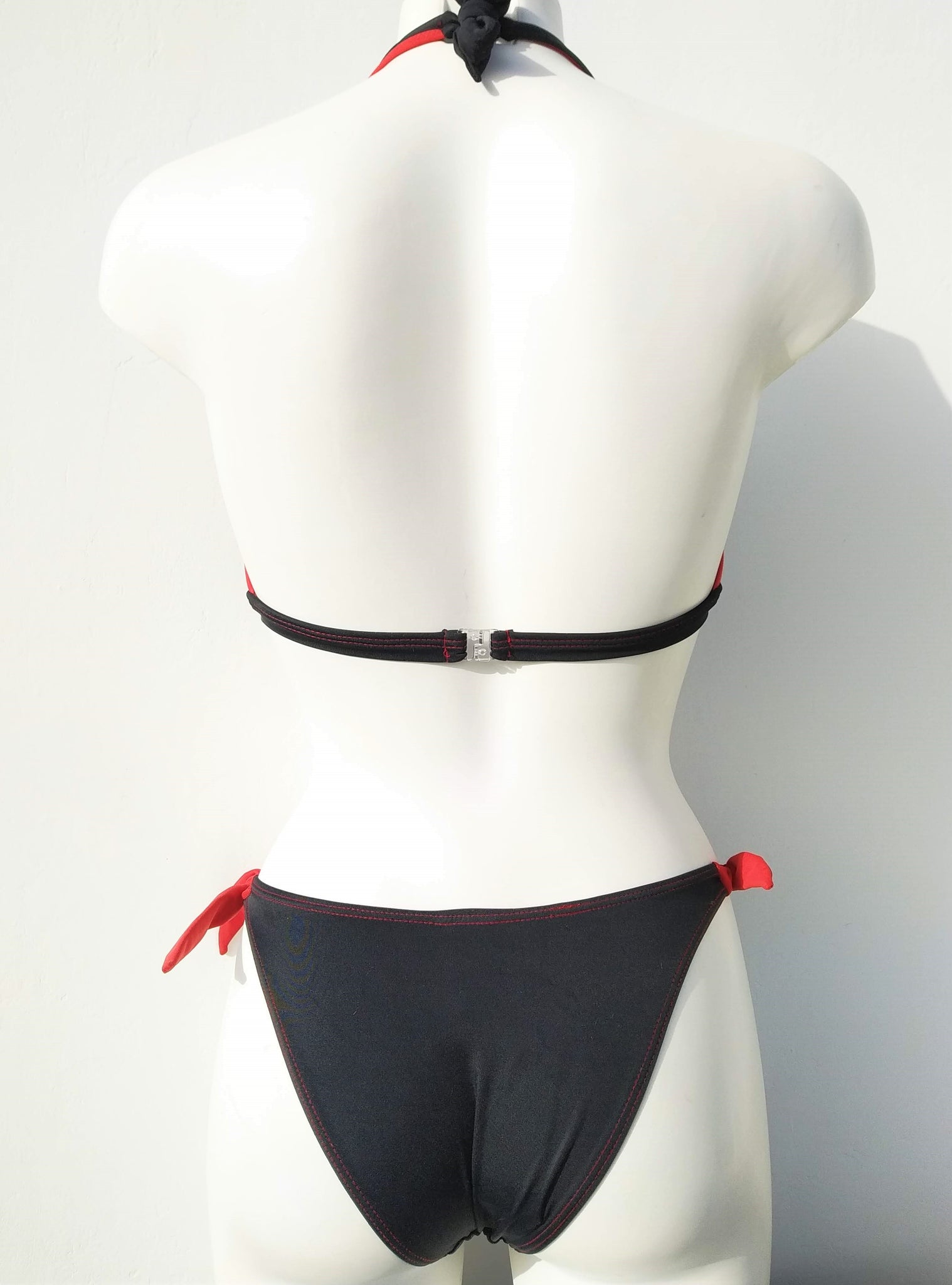 back view of black bikini halter bra and tie side cheeky bottom, seashell decoration, mix and match collection. bikinn.com