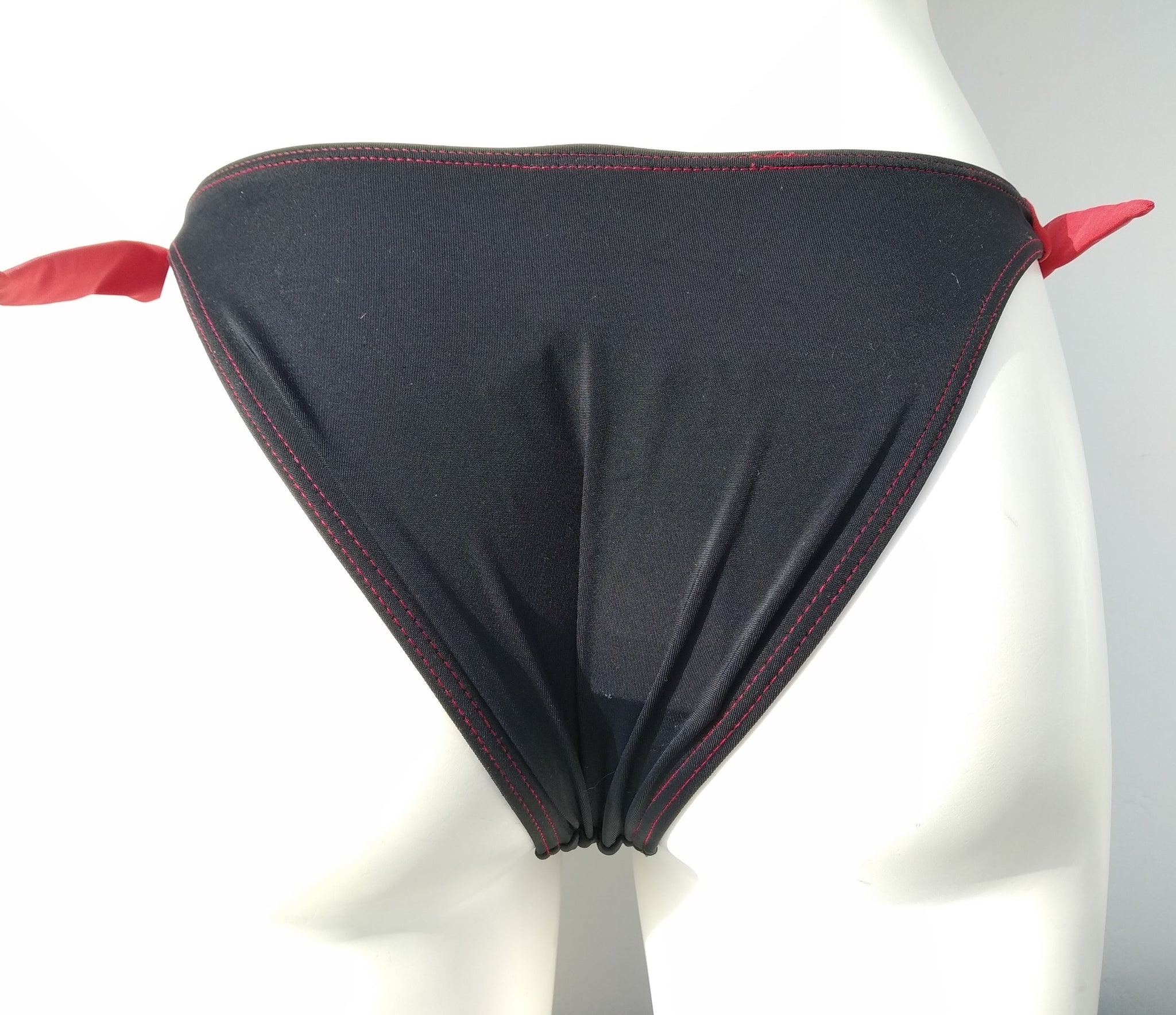back view of Black thick tie side bikini bottom, seashell decoration, mix and match collection. bikinn.com