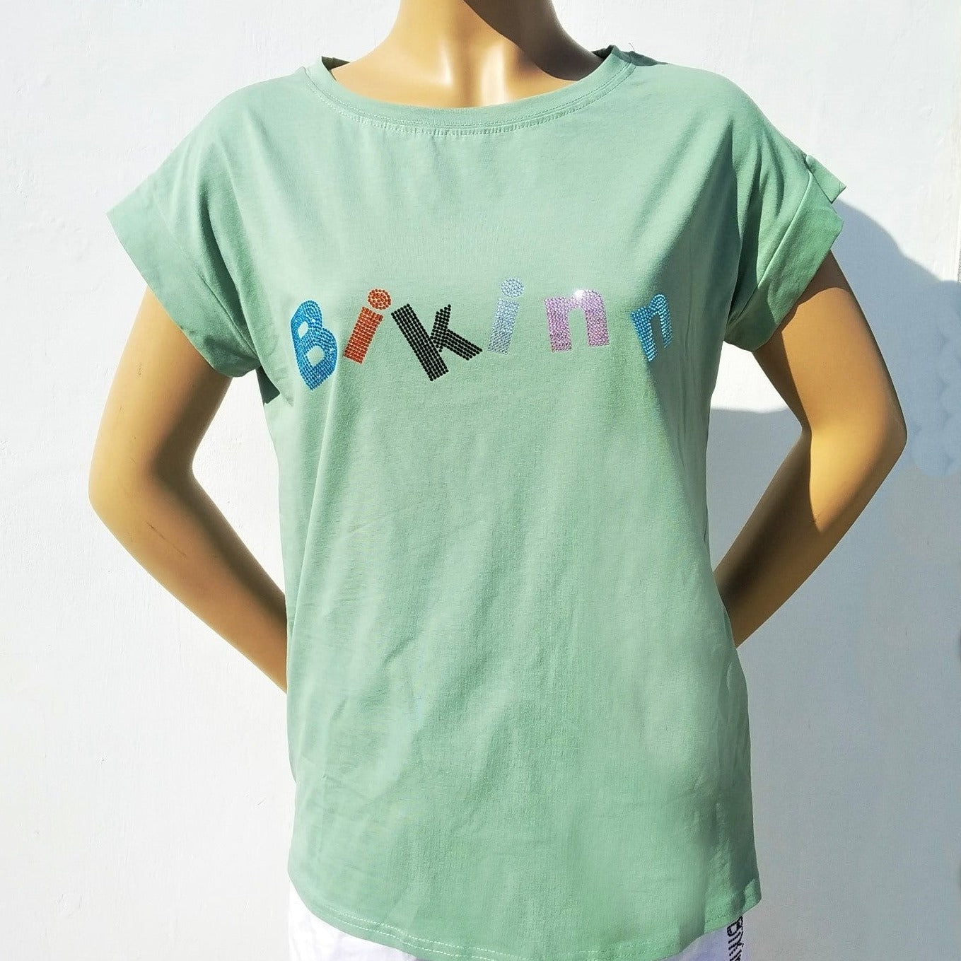 Green  short sleeves cotton-lycra T-shirt, multicolor rhinestones crystals printed logo. Bling-bling fashion. bikinn.com