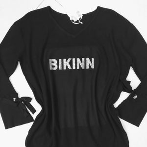 large black tunic fine cotton sweater, with a crystal logo printed on the front: "BIKINN". bikinn.com