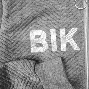 details of the rhinestone logo on a gray cotton Bling-bling Women Bomber Jacket, Casual Short Coat Zip Up. bikinn.com