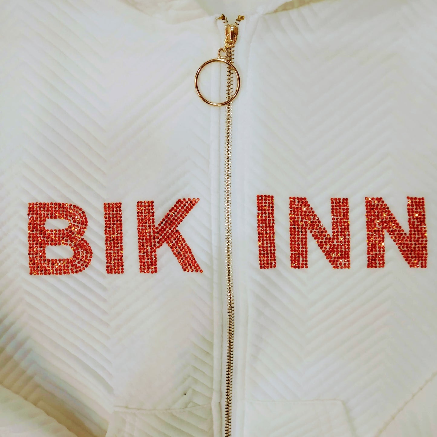 detail of the rhinestones crystal logo on white Bling-bling Women Bomber Jacket, Casual Short Coat Zip Up. bikinn.com